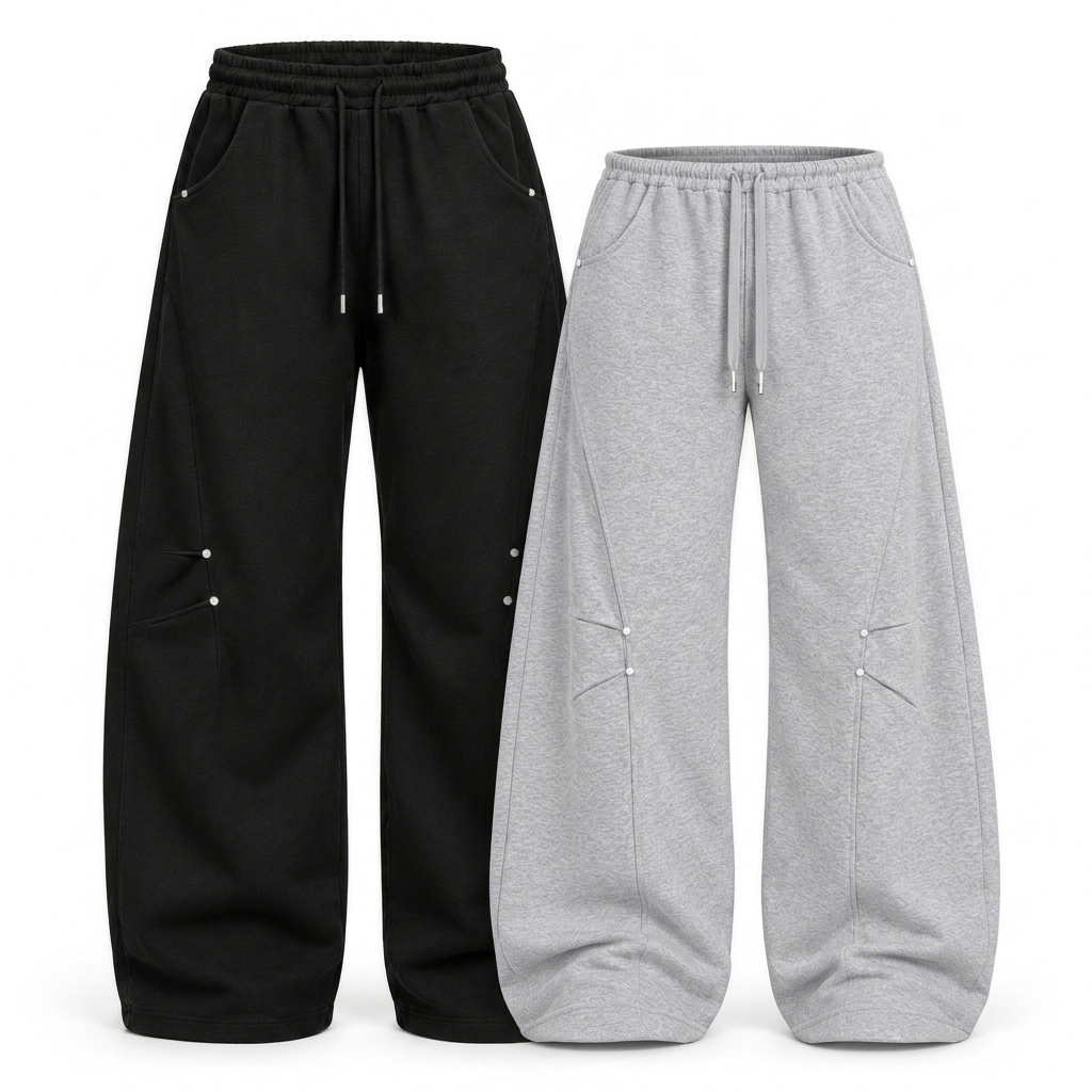 Black and light grey baggy barrel trousers pack of two in a styled diagonal flat-lay on white